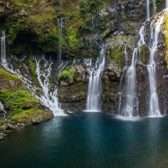 Rainforest waterfall flowing over rocks, Reunion Island